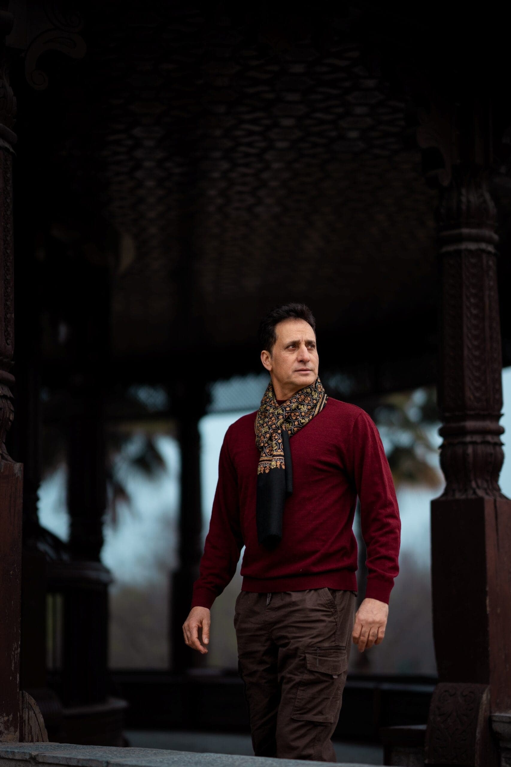 Man wearing a hand-embroidered wool scarf